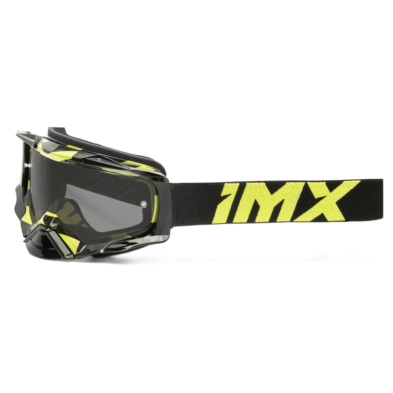 IMX Goggles Dust Graphic Fluo Yellow Gloss/Black med svart band och fluorescerande gula detaljer, idealiska för motocross och stadskörning.